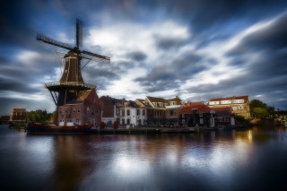 Windmill water boat cityscape cloudy - a windmill free wallpaper for desktop