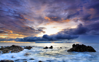 Sunset ocean clouds rocks dusk - a sunset over the ocean free wallpaper