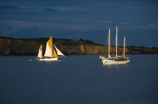 Sailboats mountain night blue sky - kodachrome free wallpaper