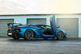 Blue sports car garage open 2 - a garage door free wallpaper