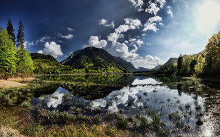Lake mountains trees cloudy sky 25 - a forest below free wallpaper