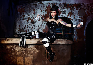 Woman black outfit hat sitting - a ledge free wallpaper