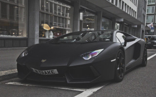 Black sports car road building - the side of the road in front free wallpaper for desktop