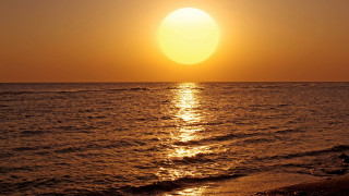 Sunset ocean surfer boat shore - a surfer free wallpaper