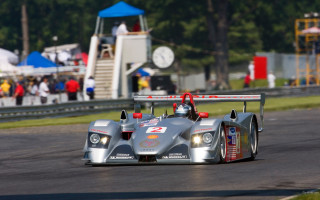Racecar stand clocktower motionblur 3d - a race car free wallpaper