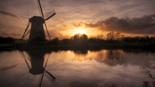 Windmill sunset water cityscape clouds - a windmill free wallpaper for desktop