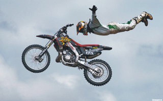 Man flying motorcycle helmet gloves - extreme illustration free wallpaper