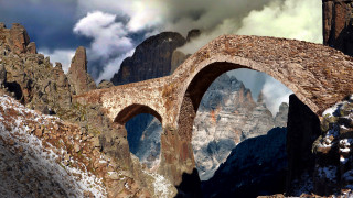 Stone bridge mountain clouds fantasy - a mountain range in the background free wallpaper
