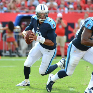 Football player running ball crowd - free sports wallpaper for tablet