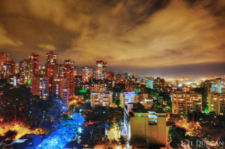 City skyline night colorful cloudy - free neon wallpaper for desktop