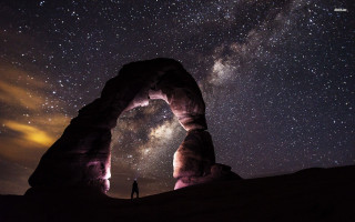 Person standing arch night sky - milky free wallpaper