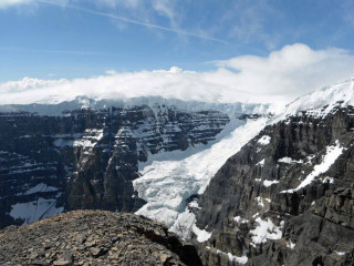 Mountain snow sky clouds person - mountain in the background free wallpaper