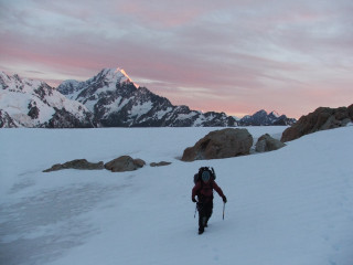 Person walking snowy hill backpack - a snowy hill free wallpaper