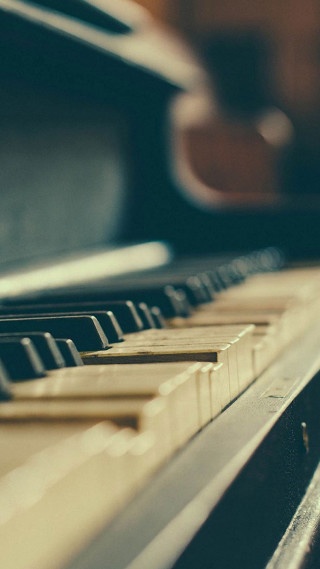 Close up piano keyboard blurry - cinematic composition free wallpaper for mobile