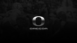 Football player holding ball oregon - a football player free wallpaper