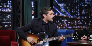 Man playing guitar sitting microphone - a man playing free wallpaper