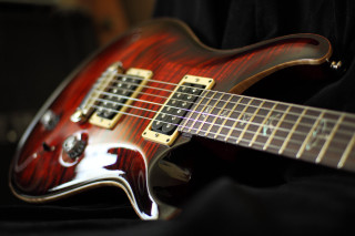 Red electric guitar black background - electric free wallpaper