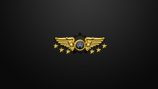 Gold emblem stars black background - a star in the middle of the image free wallpaper