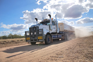 Truck driving dirt road sky - a truck free wallpaper