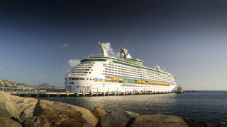 Cruise ship docked rocks pier - a pier in the background free wallpaper