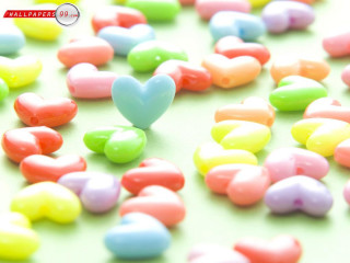 Heart shaped candy on table - a heart free wallpaper for desktop