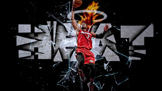 Basketball player dunking fire face - a basketball in the air free wallpaper