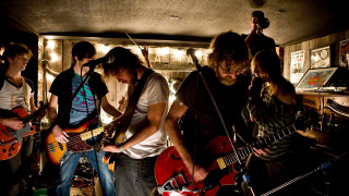Young men playing guitars room - a flemish baroque free wallpaper
