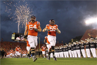 Football players running fireworks crowd - explosion free wallpaper