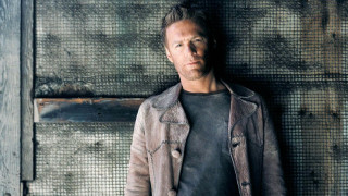 Man wall serious hyperrealism city - his hands in his pockets free wallpaper