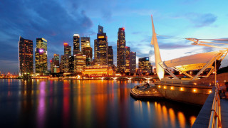 City skyline boat water night 2 - the water and a boat in the foreground free wallpaper