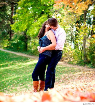 Man woman embracing park trees - free valentines wallpaper for tablet