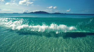 Breaking wave ocean small island - a small island in the distance free wallpaper for desktop