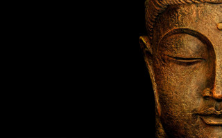 Buddha statue closeup black background 4 - facial feature free wallpaper for desktop