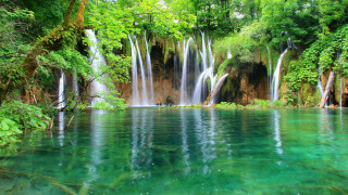 Waterfall forest green trees blue - a blue pool of water free wallpaper