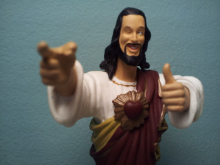 Jesus statue pointing smiling chest - a statue free wallpaper
