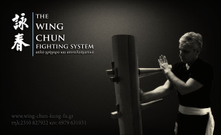 Woman handstand machine black background - diffuse free wallpaper