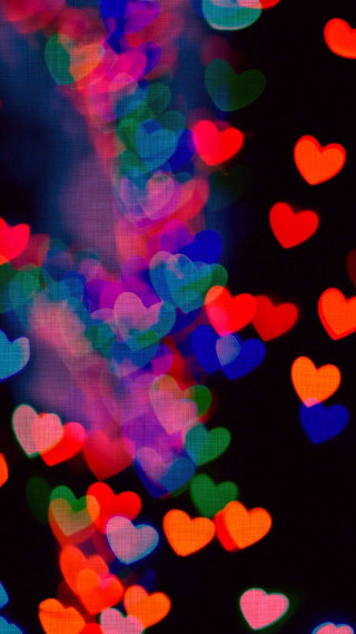 Blurry hearts dark building background - a blurry photo free wallpaper for mobile