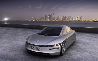 Silver car brick road city - a silver car free wallpaper