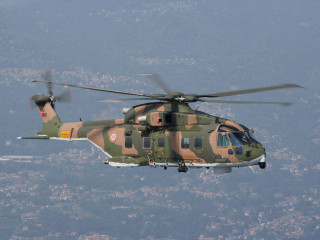 Military helicopter flying city sky - free airplane wallpaper for desktop