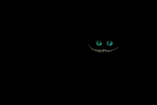 Black background green face glowing - a green face free wallpaper