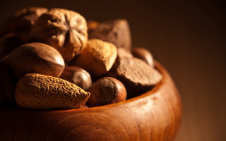 Wooden bowl filled with nuts - a wooden bowl free wallpaper