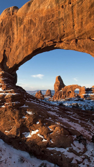 Rock formation snow blue sky - free winter wallpaper for mobile