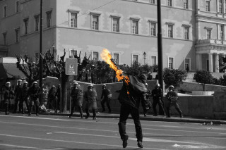 Man running street fire stick - a street holding free wallpaper for desktop