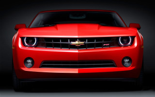 Red car black background image - a red car free wallpaper