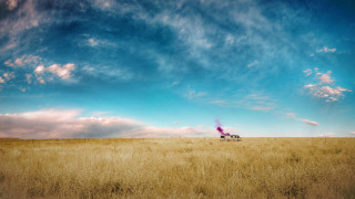 Truck driving field sky background - a truck driving free wallpaper