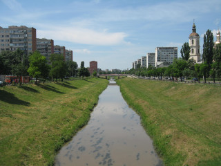 River lush park tall buildings - danube school free wallpaper