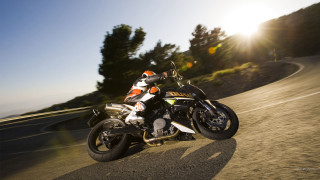 Motorcycle driving road hill trees - a motorcycle free wallpaper