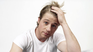 Messy hair man serious portrait - head and shoulders portrait free wallpaper for desktop