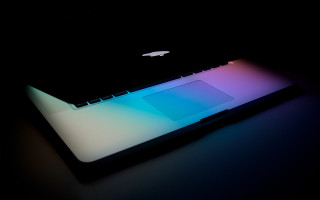 Laptop colorful screen table black - a table top free wallpaper