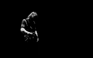 Man playing guitar dark background 3 - a man playing free wallpaper
